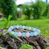 Kép 2/5 - Akvamarin - Rózsakvarc fazettált karkötő 8 mm - 1. osztályú